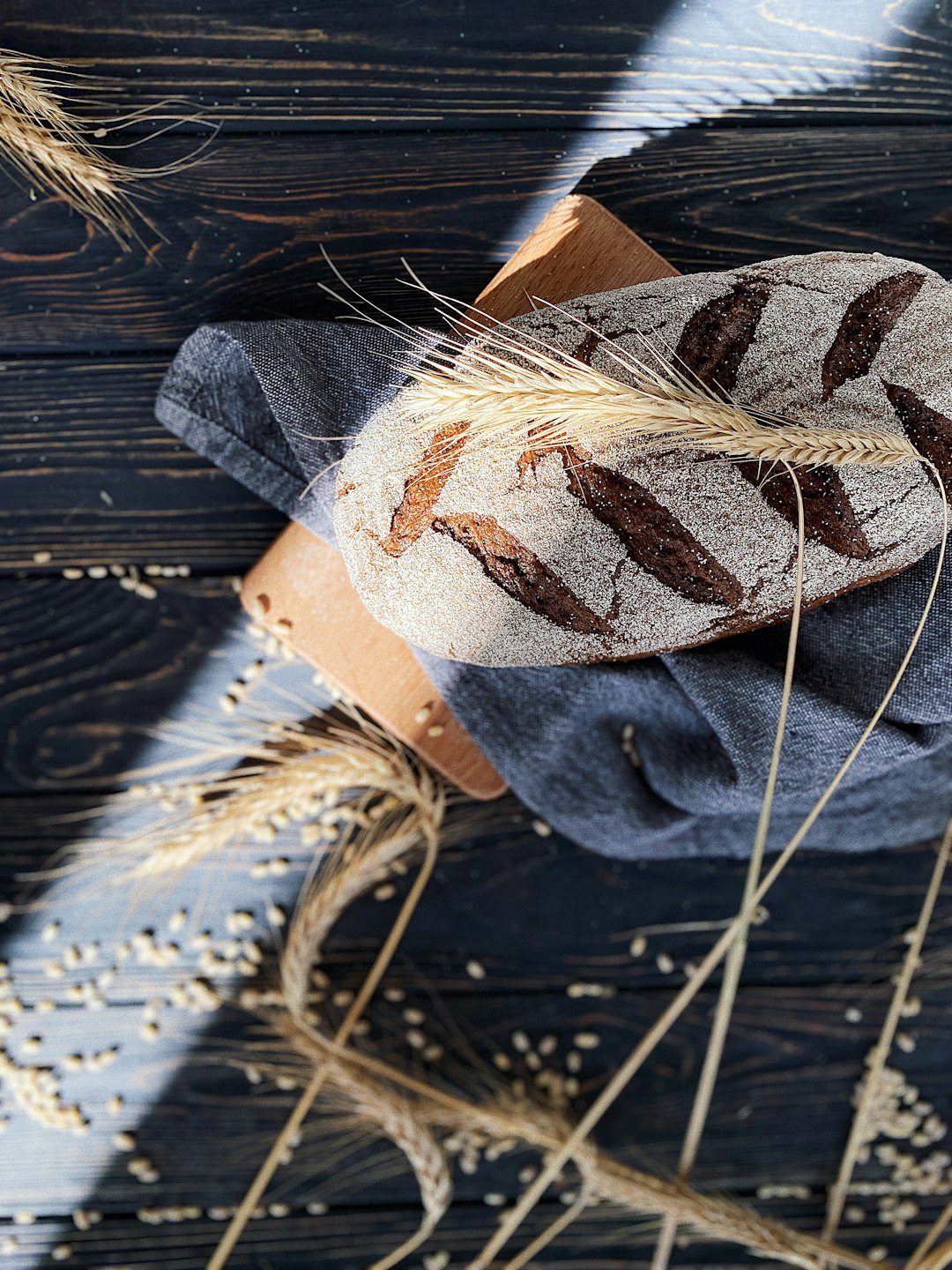 An AI-generated image of freshly baked artisanal bread on a wooden board.