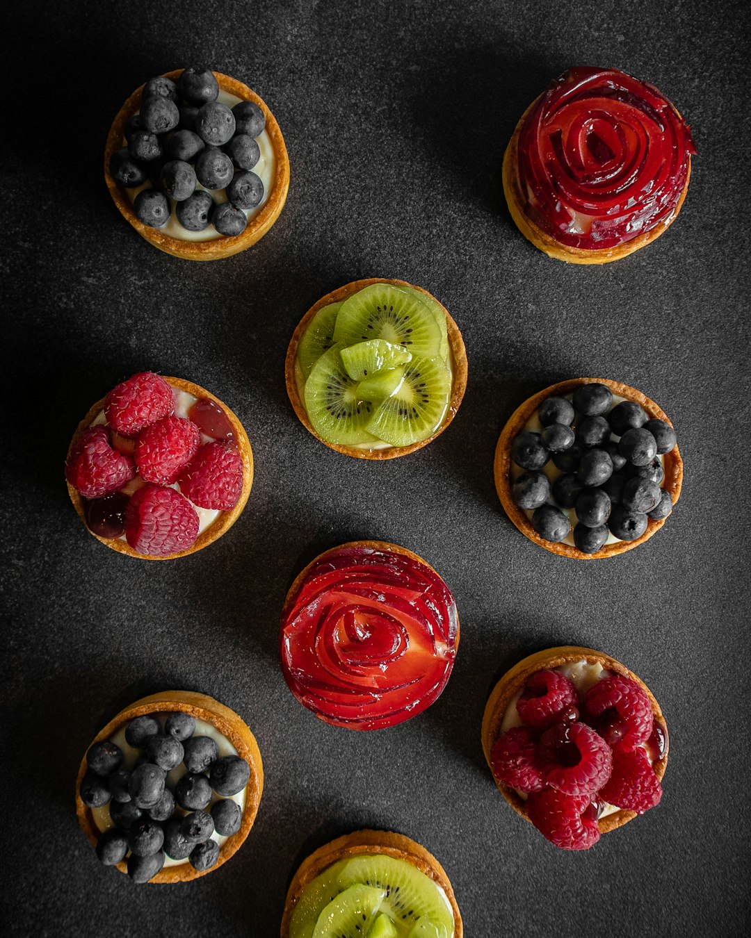 An AI-generated image of a vibrant fruit tart with glossy finish.